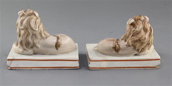 A pair of Wood & Caldwell pearlware models of recumbent lions, c.1800, l. 12.5cm, slight damage